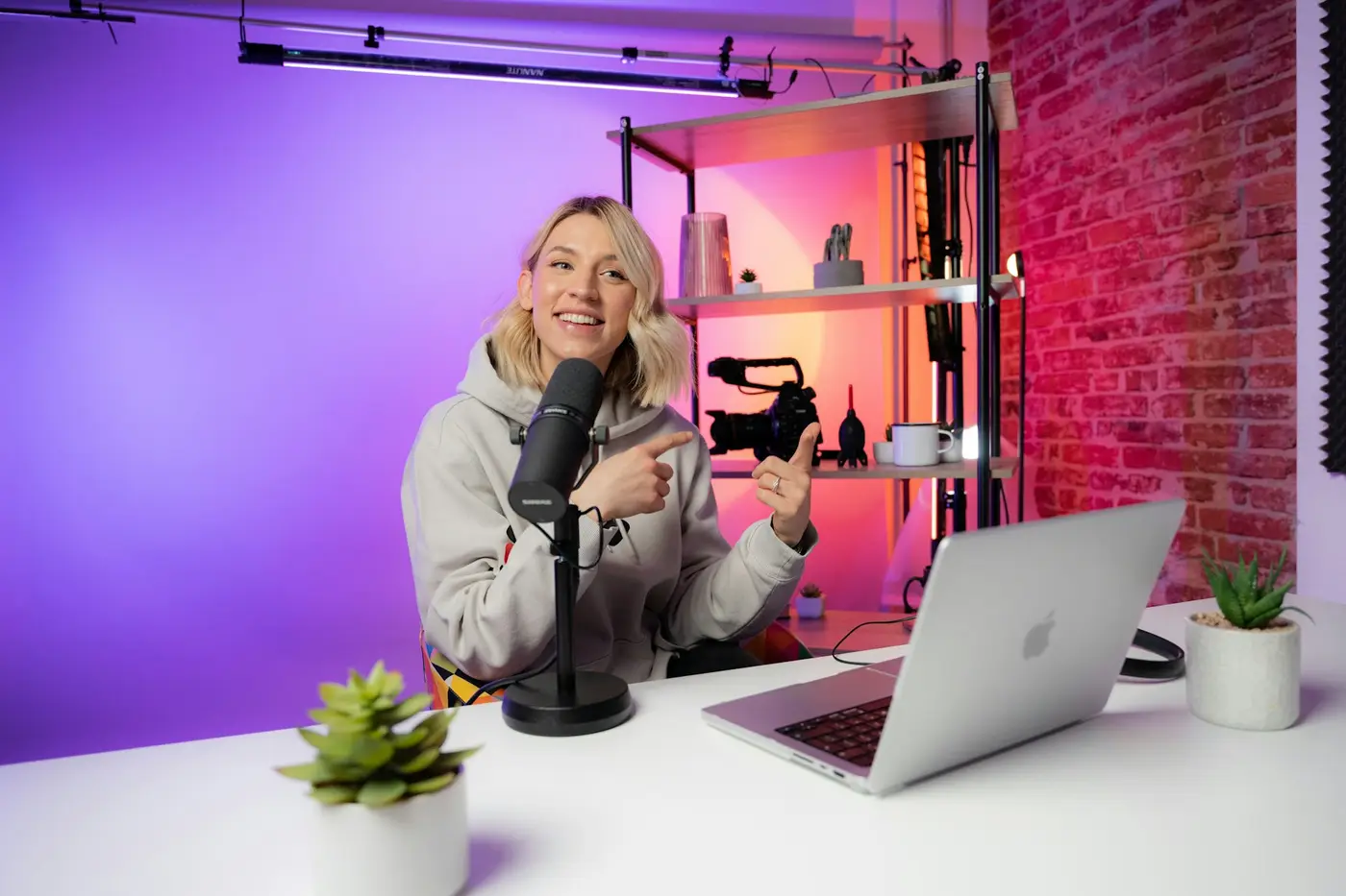 A creator recording a video at a desk